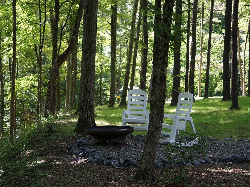 The Green Bean, exterior chairs by the wood burning firepit