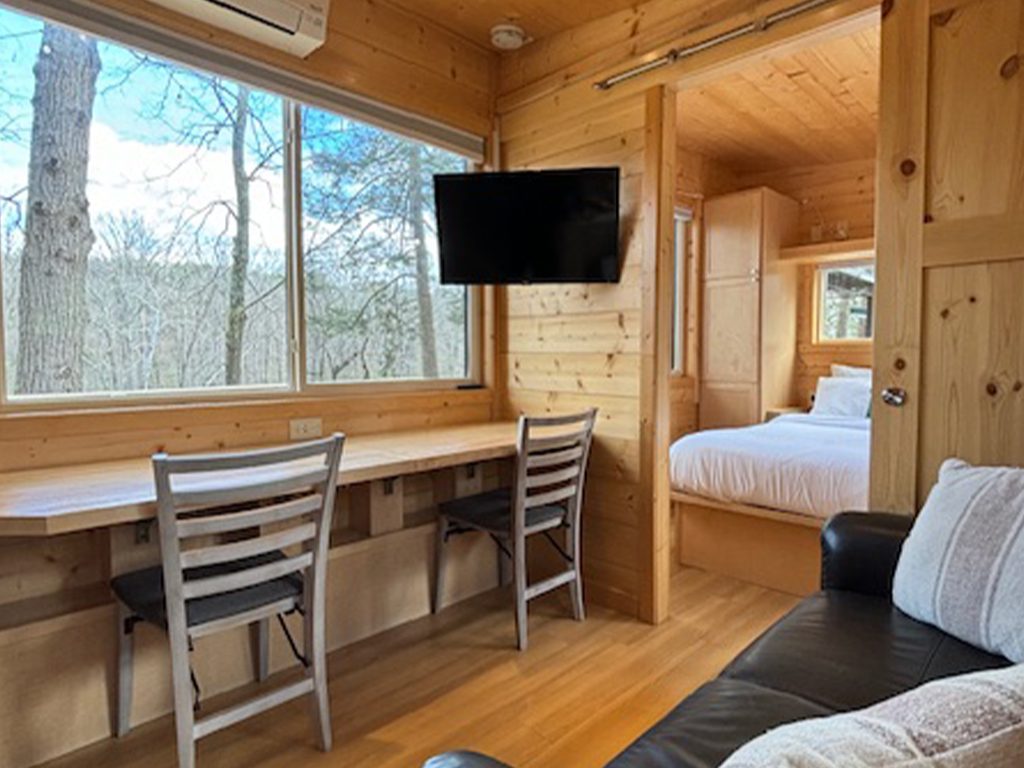 Dining area with TV overlooking the Catskill Creek