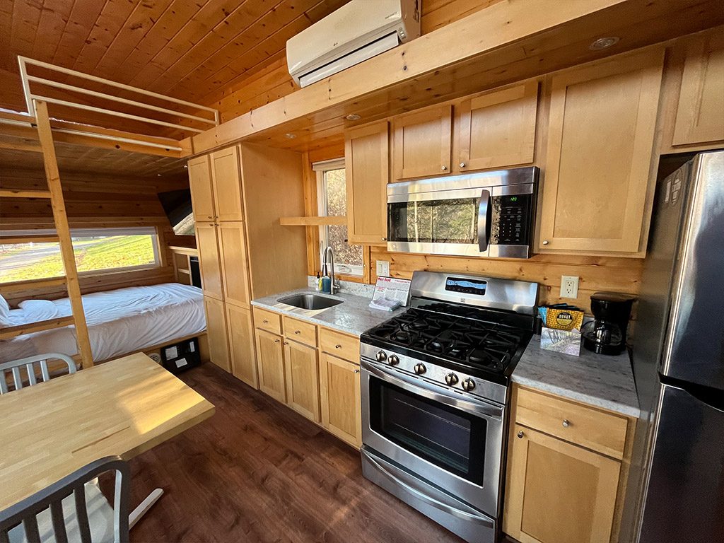 Kitchen and queen bed in the Little Bear
