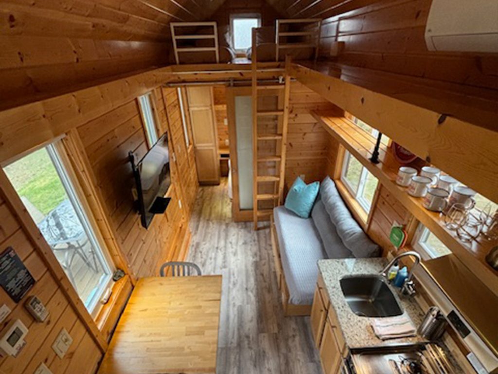 standing on the ladder look into the lodge to get a birds every view of the living space