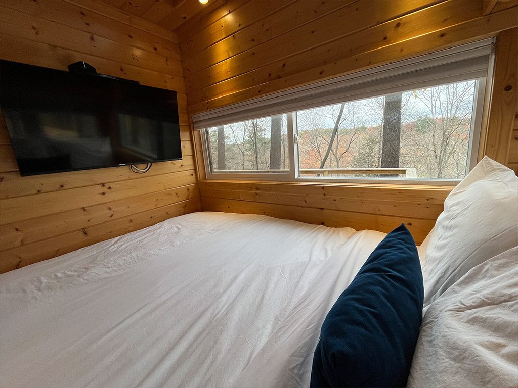 Queen bed in The Flat A Tiny House Resort